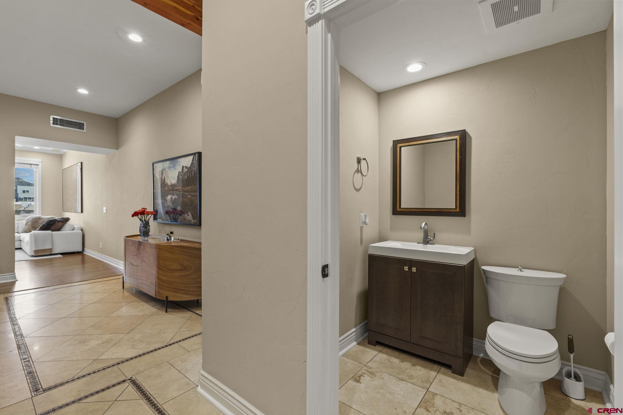 543 East 2nd Avenue, Unit 3E Durango, CO 81301 - Photo 13 of 39 a bathroom with a toilet sink and mirror