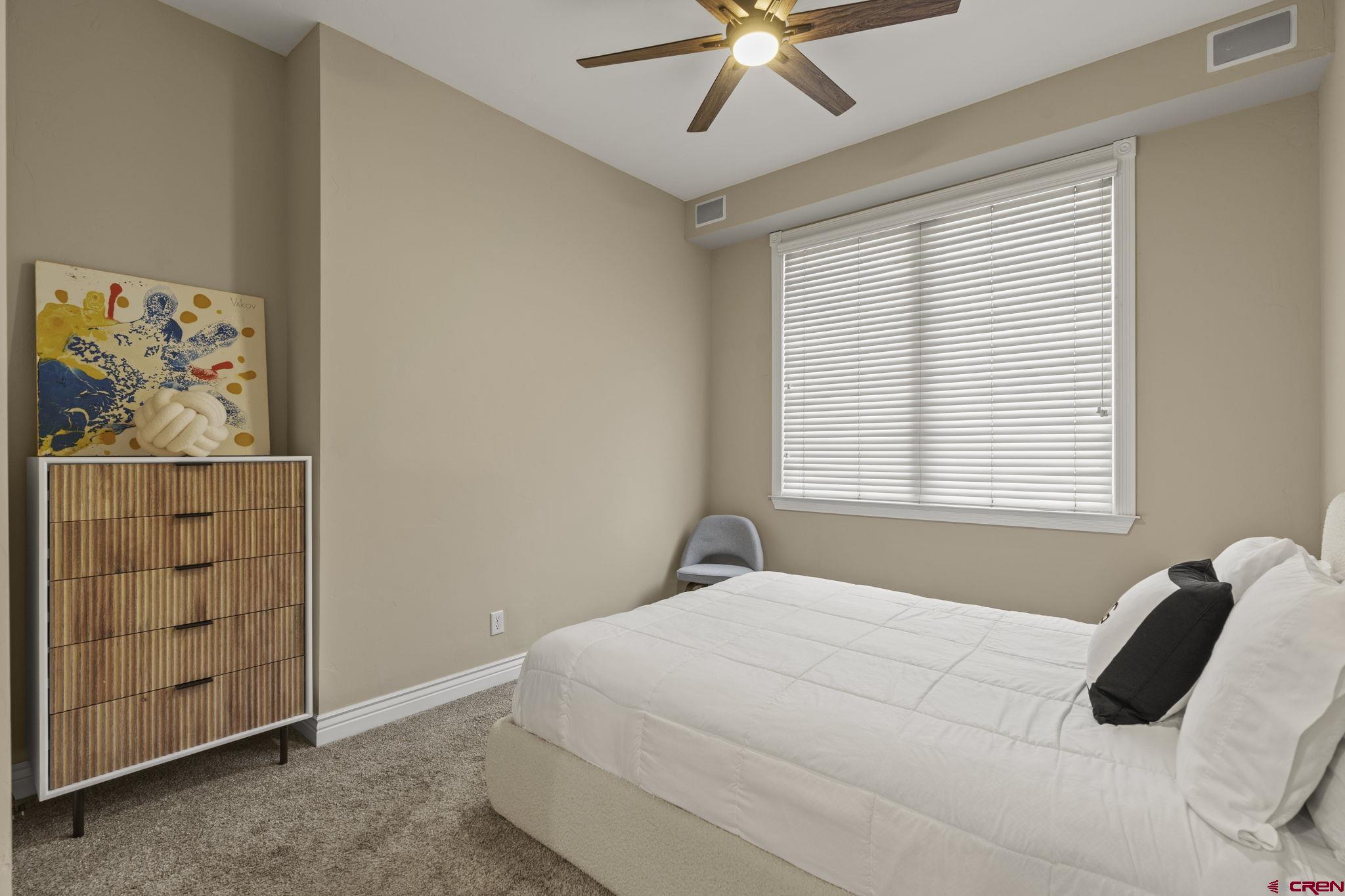 543 East 2nd Avenue, Unit 3E Durango, CO 81301 - Photo 17 of 39 a bedroom with a bed and a window