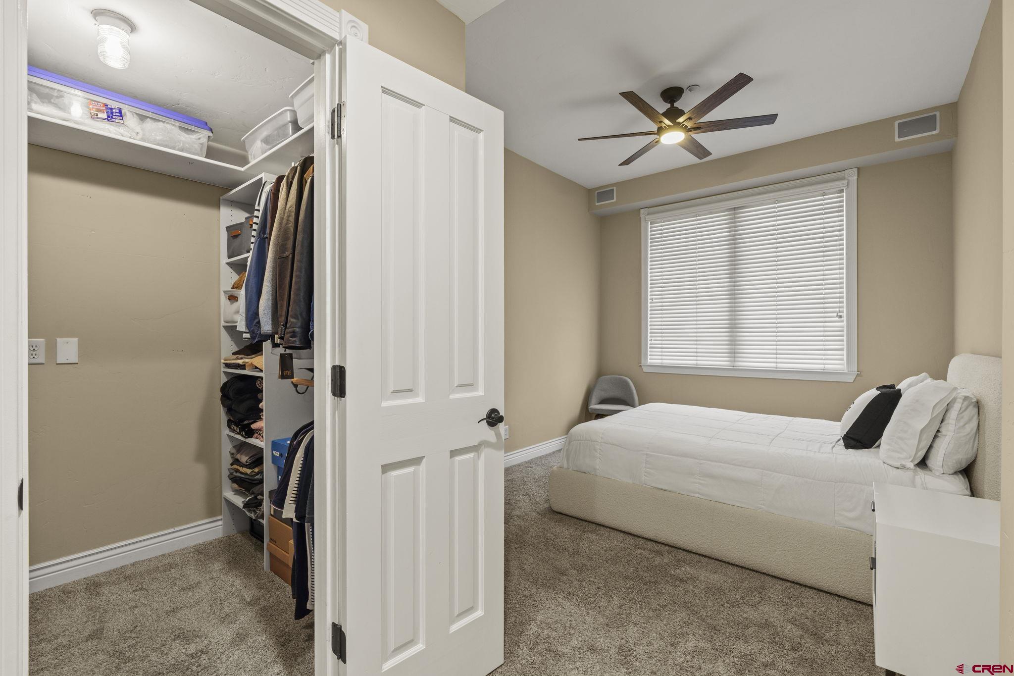 543 East 2nd Avenue, Unit 3E Durango, CO 81301 - Photo 19 of 39 a bedroom with a bed and a window