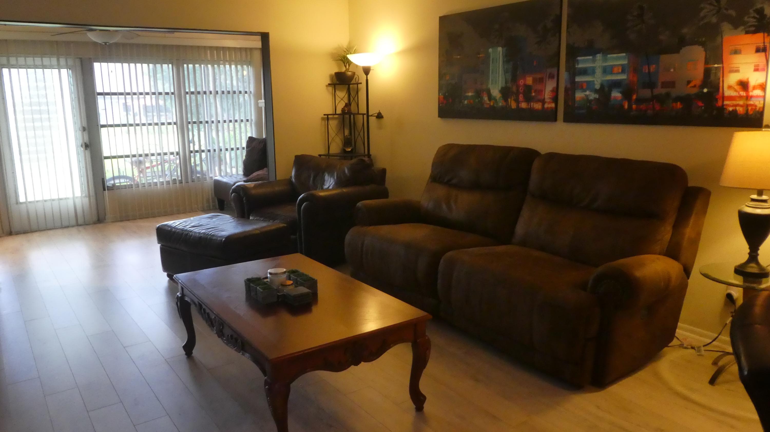 2500 Fiore Way, Unit 102C Delray Beach, FL 33445 - Photo 11 of 33 a living room with furniture and a window