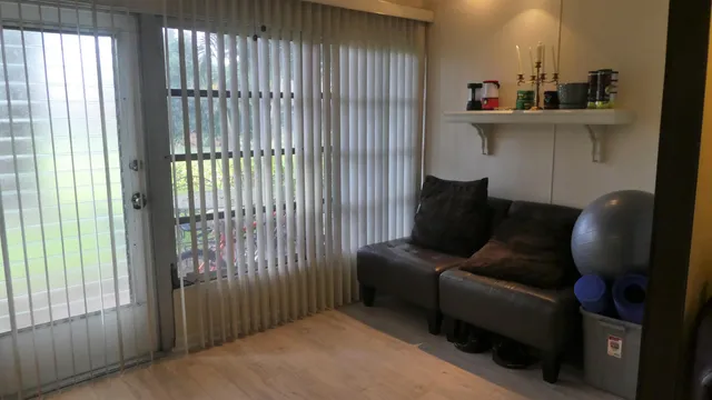 a living room with furniture and a window