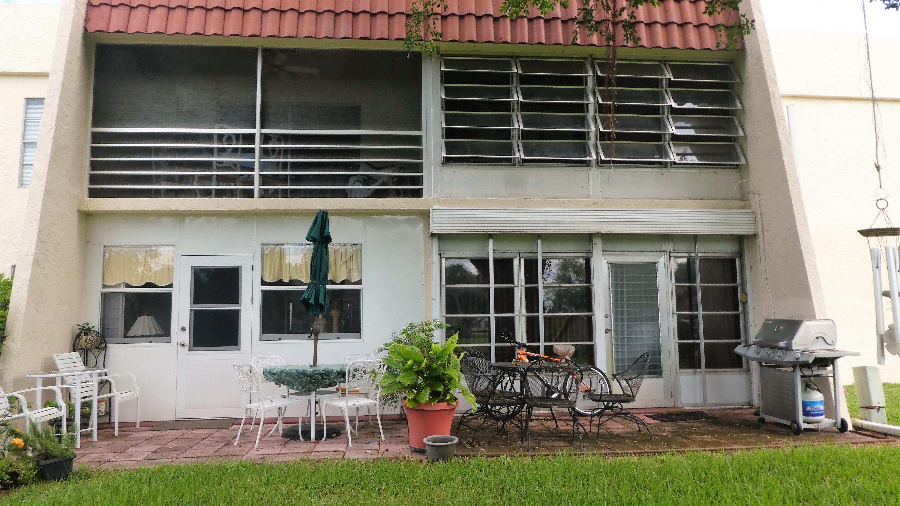 2500 Fiore Way, Unit 102C Delray Beach, FL 33445 - Photo 16 of 33 a house view with a garden space