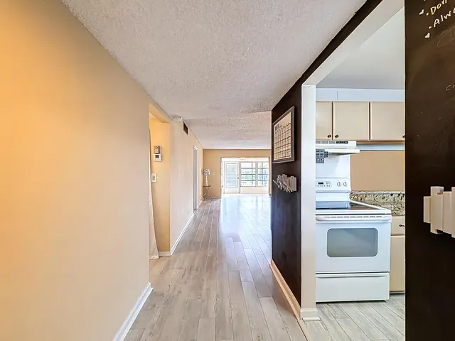 a view of a livingroom with a ceiling fan and window