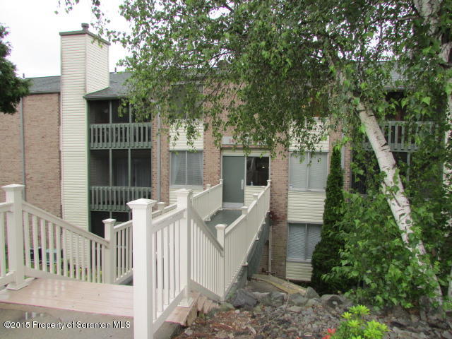 1412 Summit Pointe Scranton, PA 18508 - Photo 1 of 31 a front view of a house with a yard