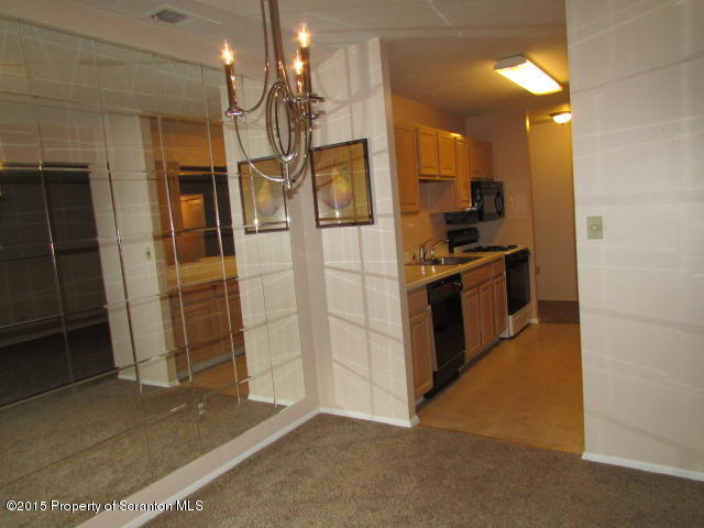 1412 Summit Pointe Scranton, PA 18508 - Photo 11 of 31 a kitchen with stainless steel appliances granite countertop a refrigerator and a sink