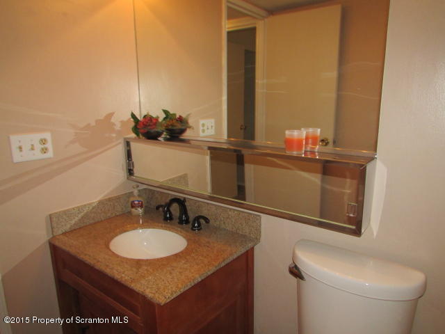 1412 Summit Pointe Scranton, PA 18508 - Photo 10 of 31 a bathroom with a granite countertop sink and a toilet
