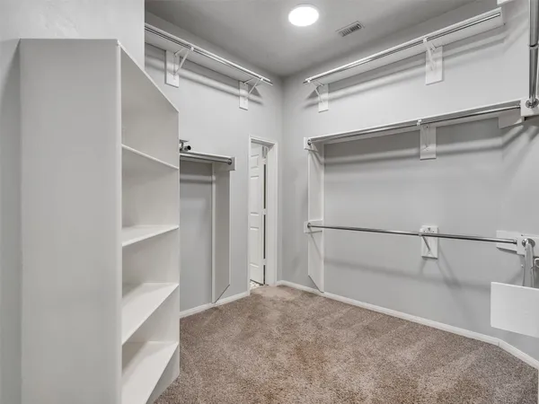 a view of an empty walk in closet