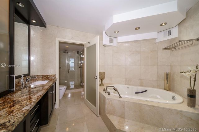 a bathroom with a toilet and shower