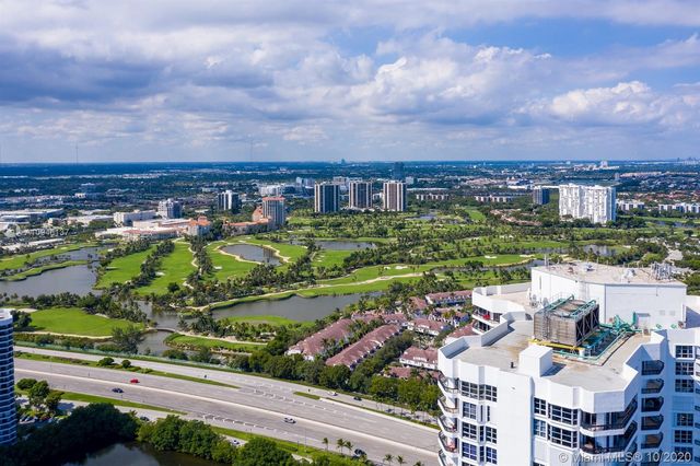 a view of a lake with a building in the background