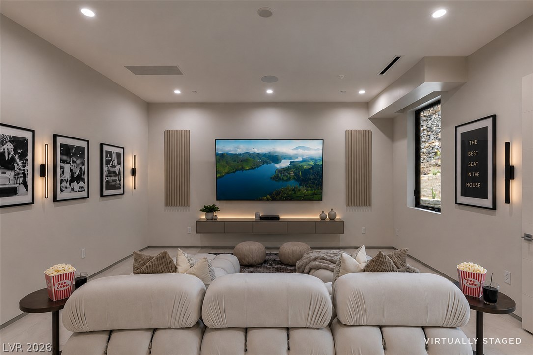 563 Grand Rim Drive Henderson, NV 89012 - Photo 32 of 70 An inviting media room perfect for movie nights, featuring cozy seating and a large display.