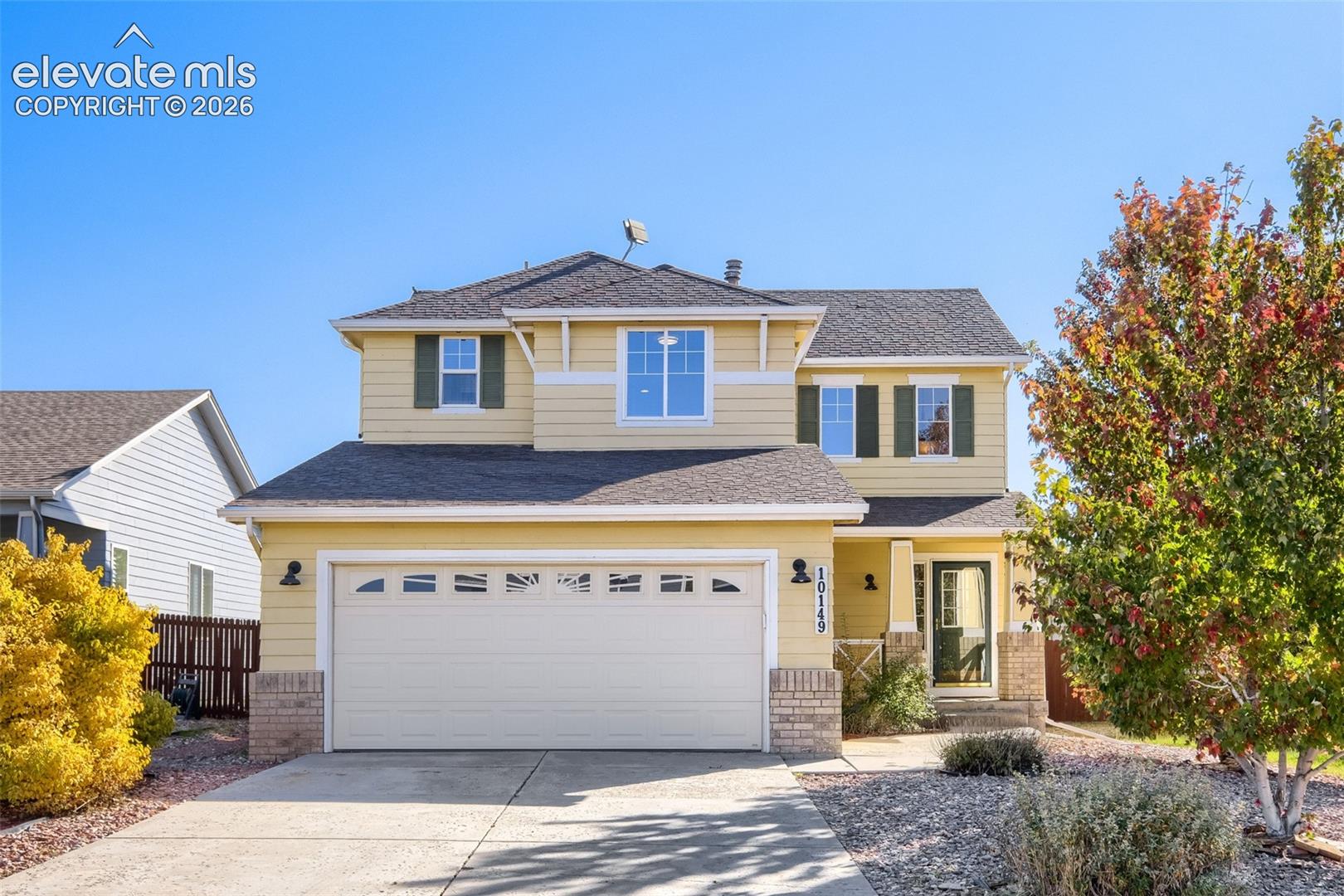 10149 Angeles Road Peyton, CO 80831 - Photo 1 of 24 Two-story residence with a two-car garage, covered entry, and brick accents