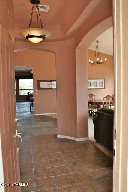 1729 East Redstart Road Green Valley, AZ 85614 - Photo 14 of 39 a view of a kitchen with a sink and a refrigerator