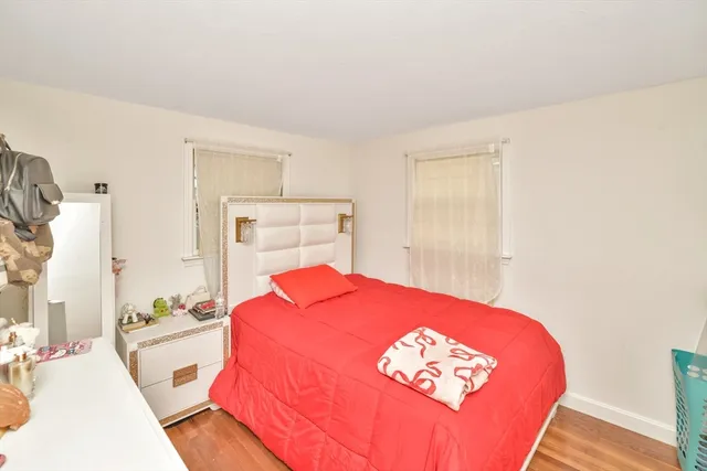 a spacious bedroom with a bed and a table