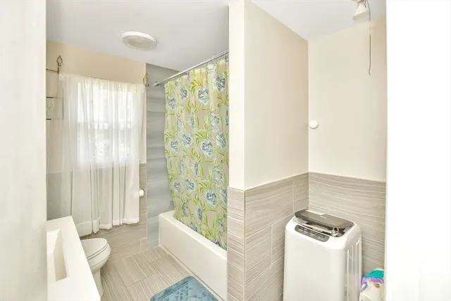 a bathroom with a bathtub and shower