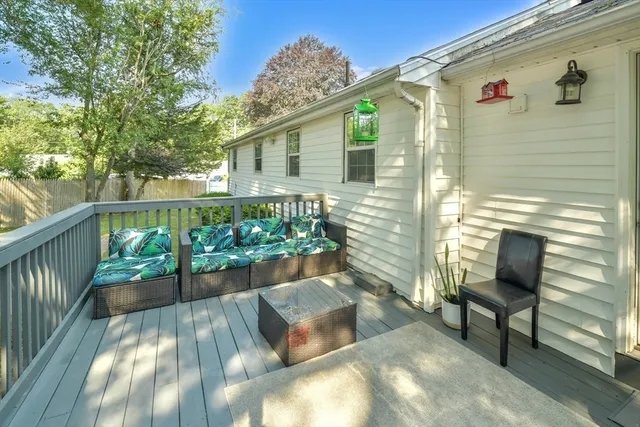 a view of a chairs and table in the balcony