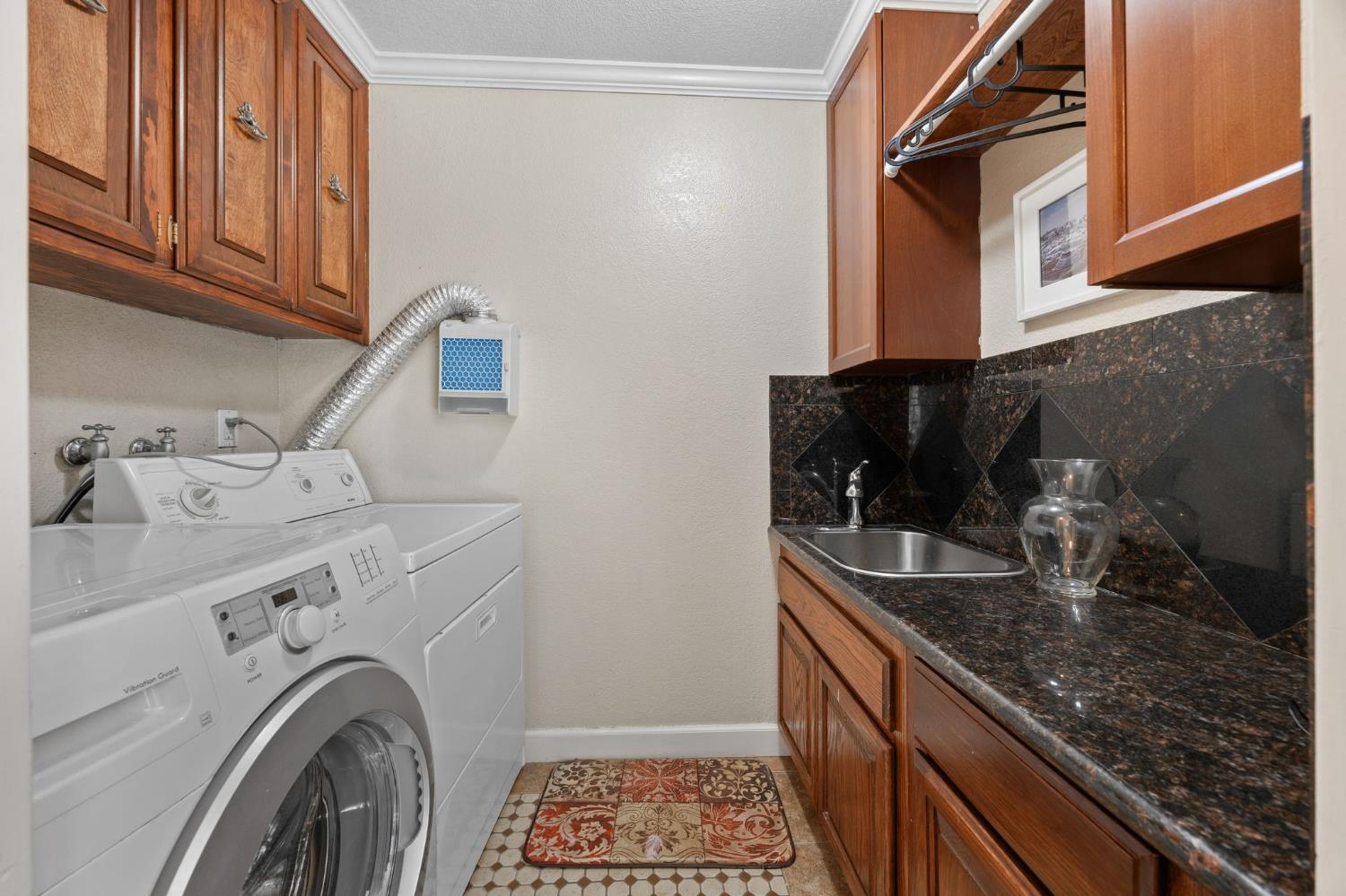 4206 Zephyr Way Sacramento, CA 95821 - Photo 16 of 45 a kitchen with a sink and cabinets