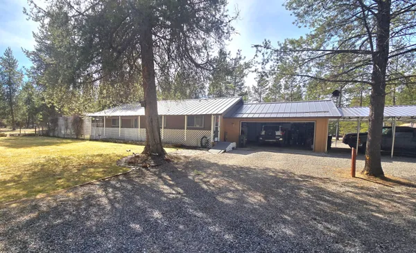 a house with trees in front of it