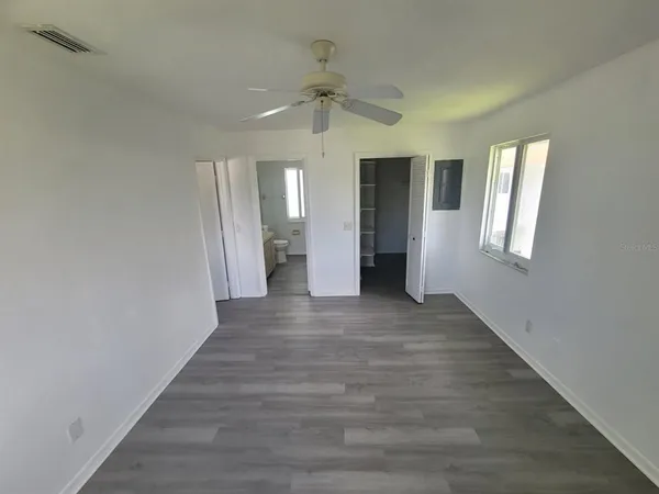 a view of an empty room with a window