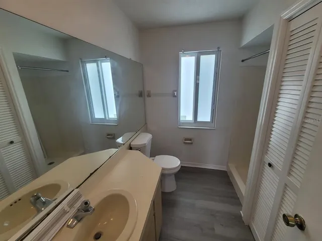 a bathroom with a glass shower door