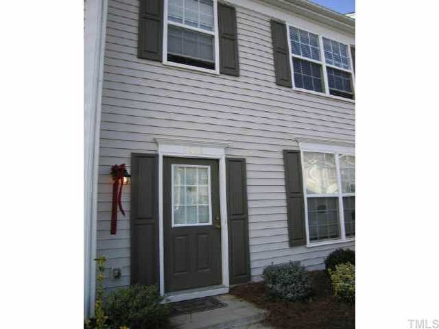 5026 Echo Ridge Road Raleigh, NC 27612 - Photo 1 of 1 a view of a house with glass windows and a yard