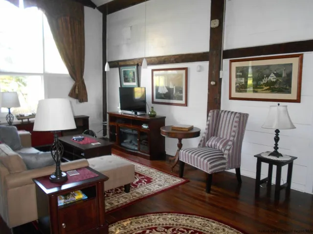 a backyard of a house with lots of green space and garden view