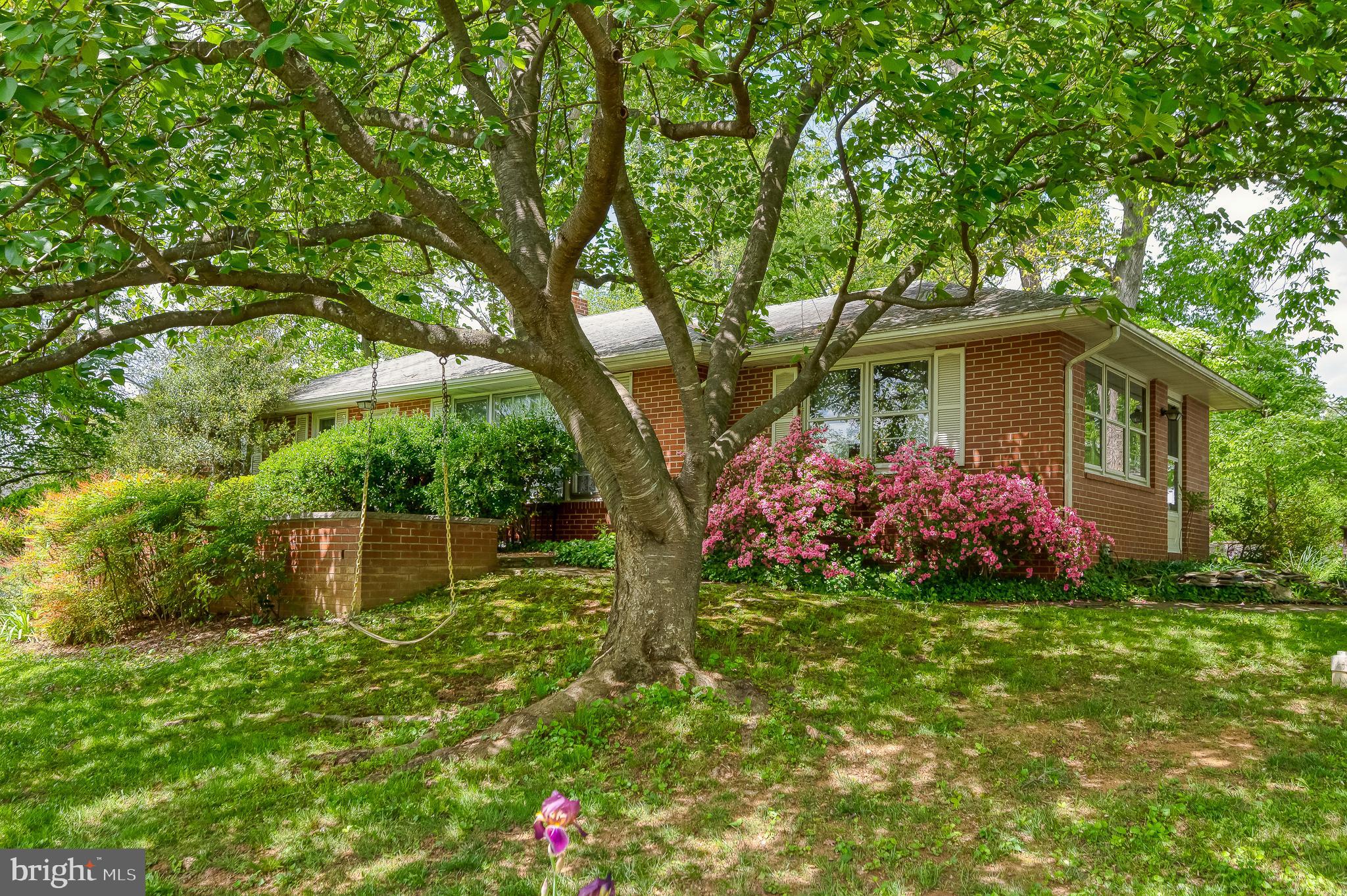 2911 Nelson Lane Fallston, MD 21047 - Photo 1 of 85 a front view of a house with a yard and a garden