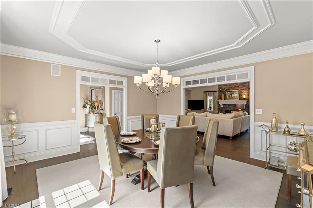 11555 Double Spring Road Lewisville, NC 27023 - Photo 15 of 50 Every guest has a view when entertaining in this lovely dining room with wainscoting and oversized passthroughs