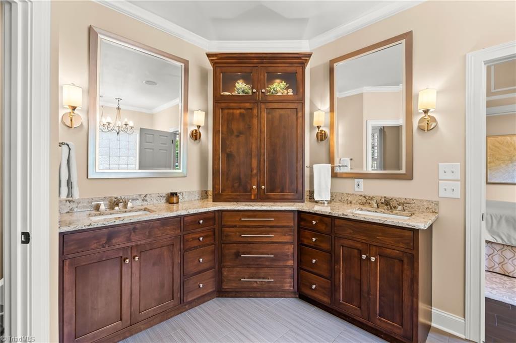 11555 Double Spring Road Lewisville, NC 27023 - Photo 19 of 50 Custom cabinets with quartz countertops and dual vanities.