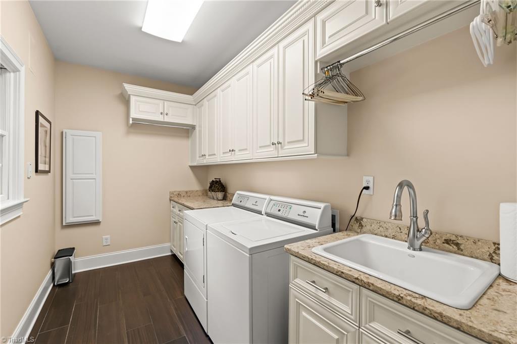 11555 Double Spring Road Lewisville, NC 27023 - Photo 22 of 50 Main level laundry room with wash sink and storage