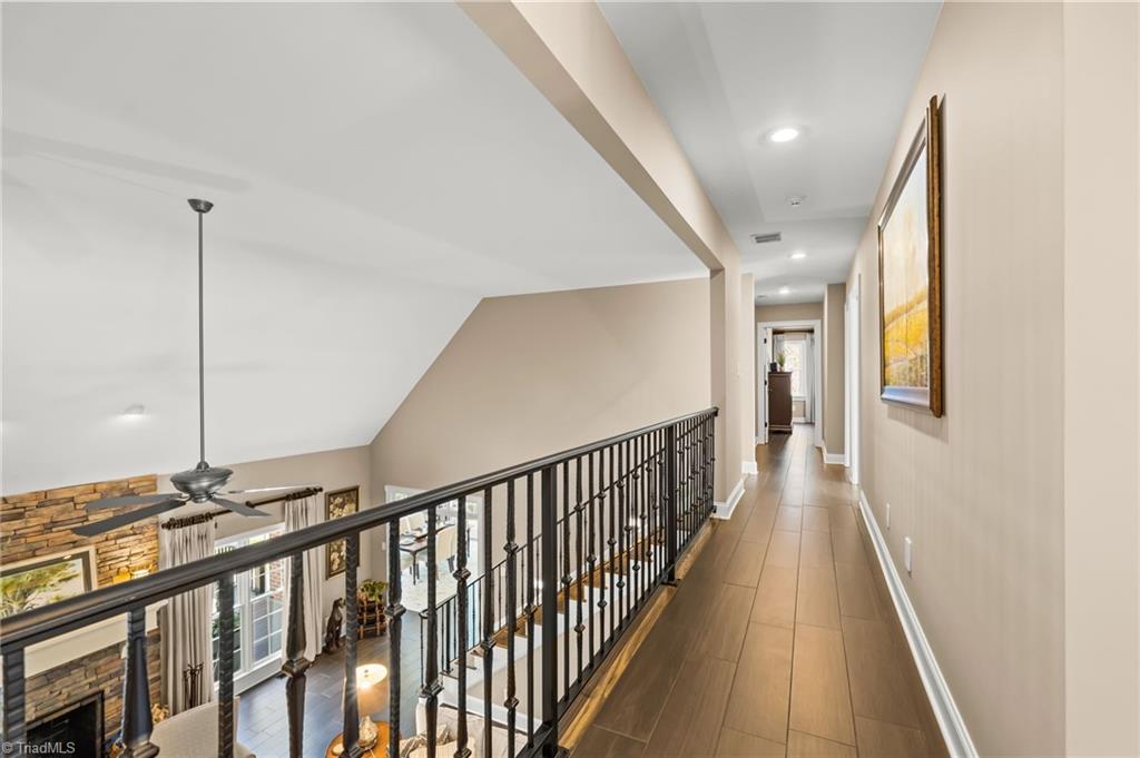 11555 Double Spring Road Lewisville, NC 27023 - Photo 24 of 50 The custom iron railing is a stand out feature overlooking the great room.