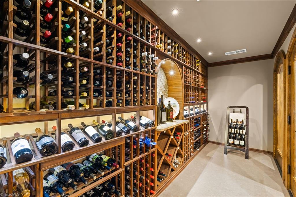11555 Double Spring Road Lewisville, NC 27023 - Photo 35 of 50 Humidity controlled wine cellar boasts cork floors and houses 775 bottles.