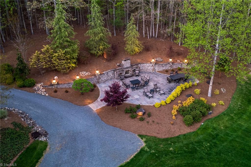 11555 Double Spring Road Lewisville, NC 27023 - Photo 7 of 50 Enjoy the outdoor fireplace with evening fires and lovely landscaping