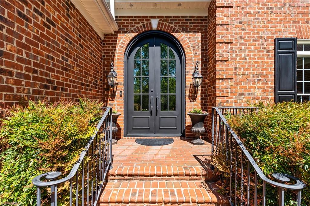 11555 Double Spring Road Lewisville, NC 27023 - Photo 8 of 50 Custom made arched 10 ft steel doors welcome you in