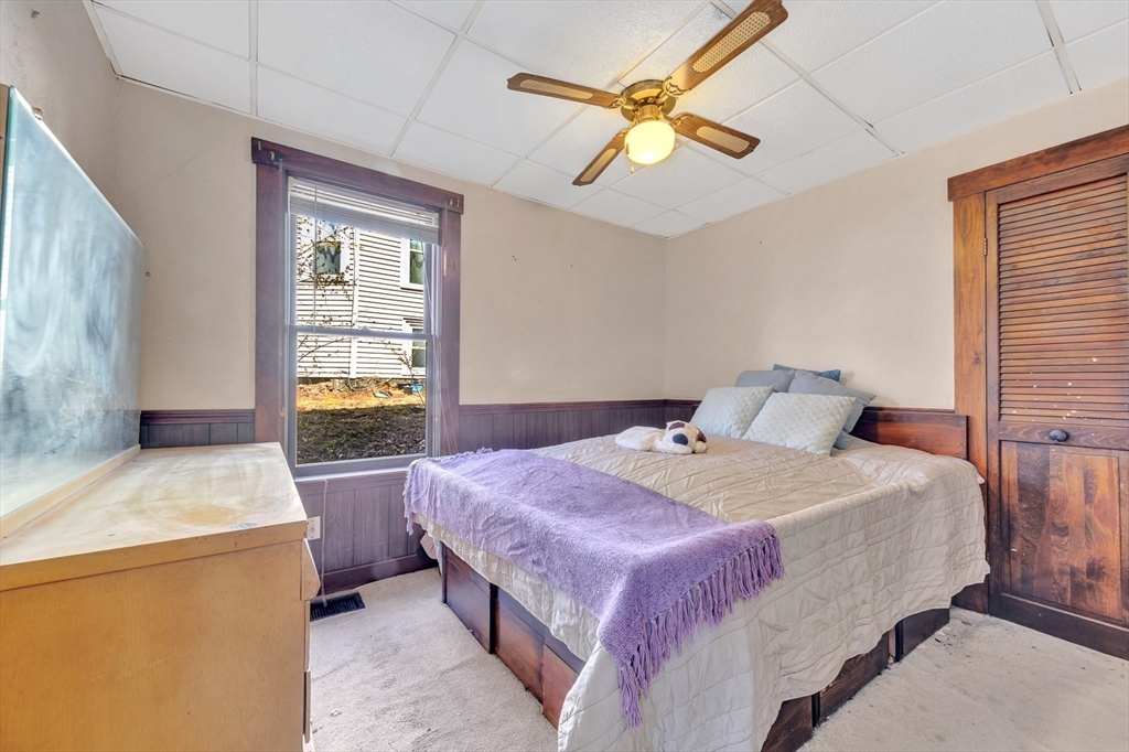 151-153 Forest Street Arlington, MA 02474 - Photo 14 of 20 a spacious bedroom with a bed and a table