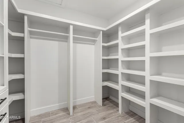 a view of closet area with empty racks