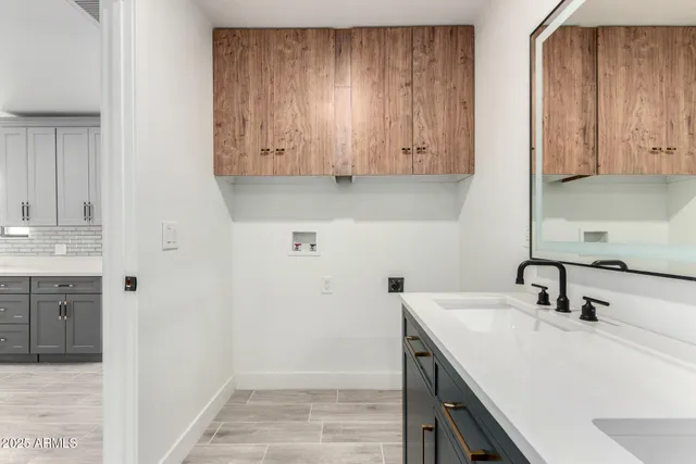 a kitchen with a sink and cabinets