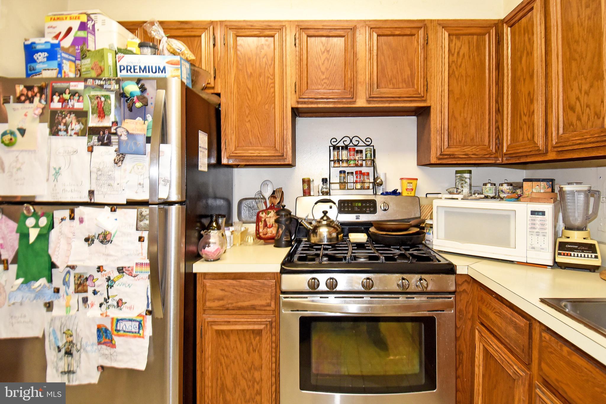429 N Street Southwest, Unit S607 Washington, DC 20024 - Photo 14 of 55 a kitchen with stainless steel appliances a stove a sink and a refrigerator