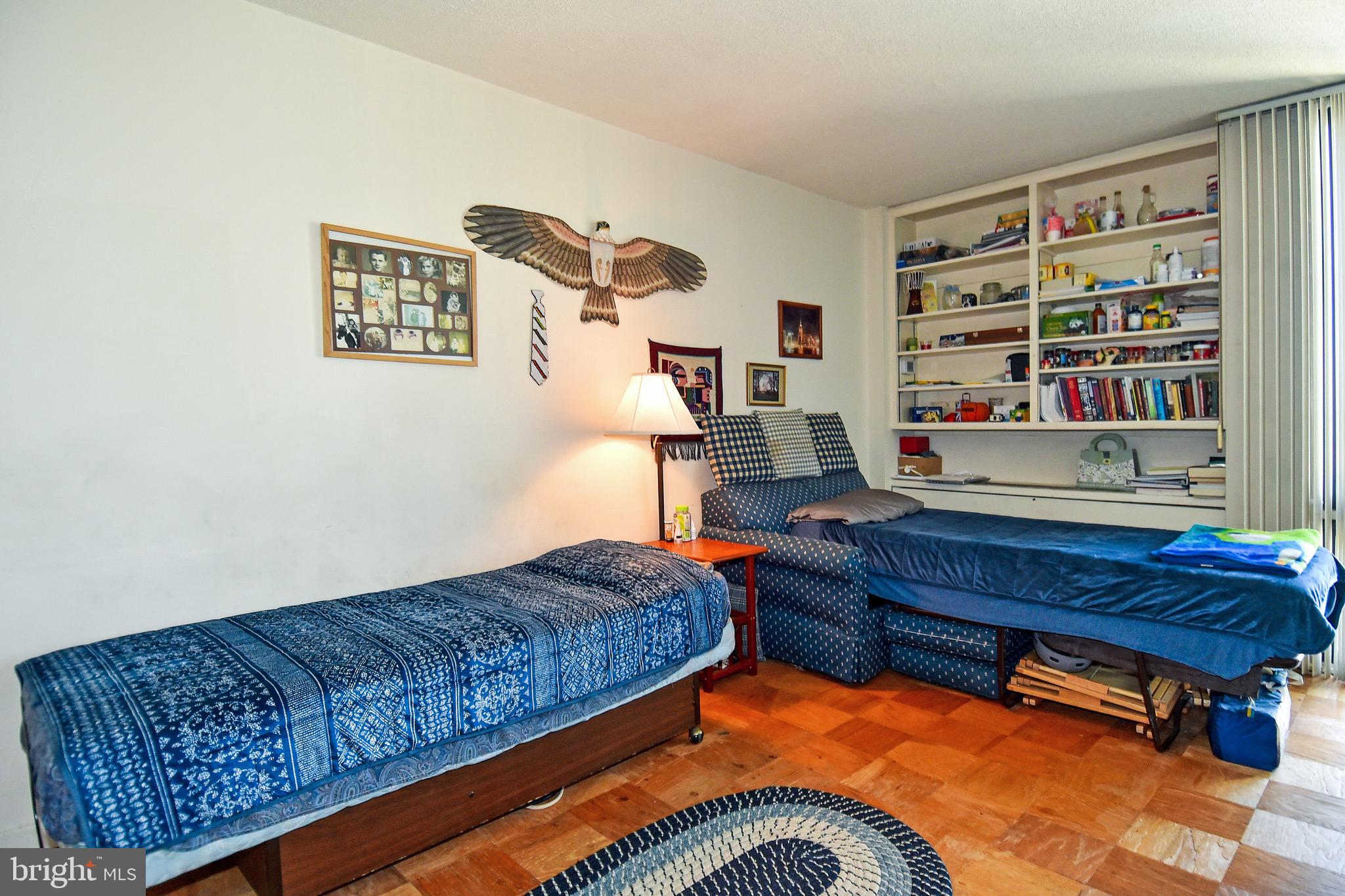 429 N Street Southwest, Unit S607 Washington, DC 20024 - Photo 17 of 55 a living room with furniture and book shelf