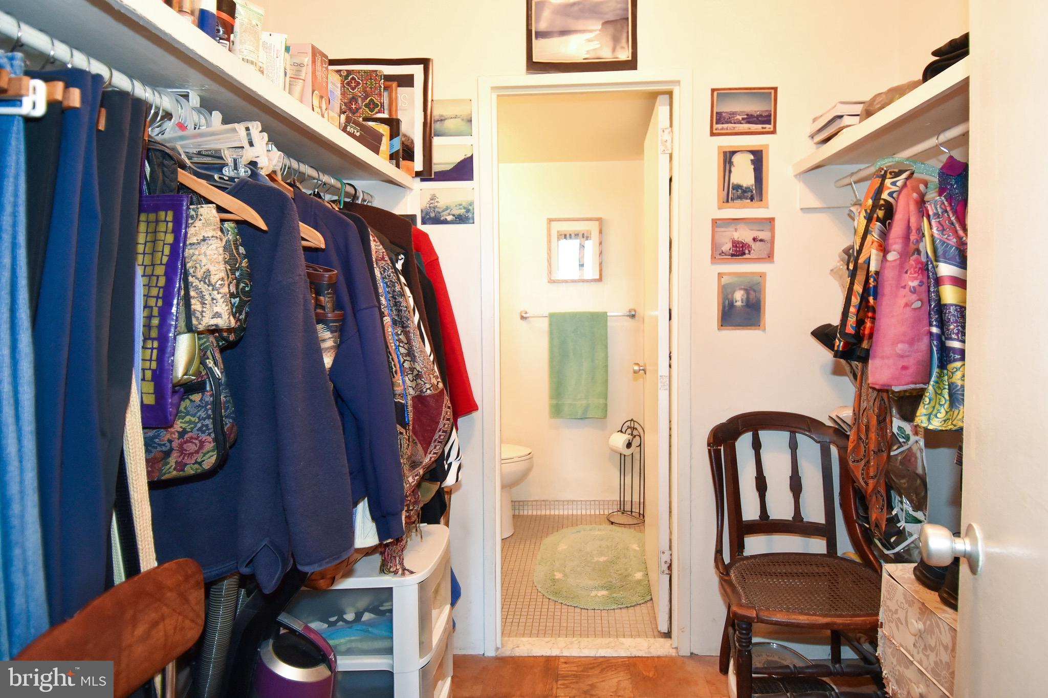 429 N Street Southwest, Unit S607 Washington, DC 20024 - Photo 25 of 55 a view of walk in closet with clothes and shoes
