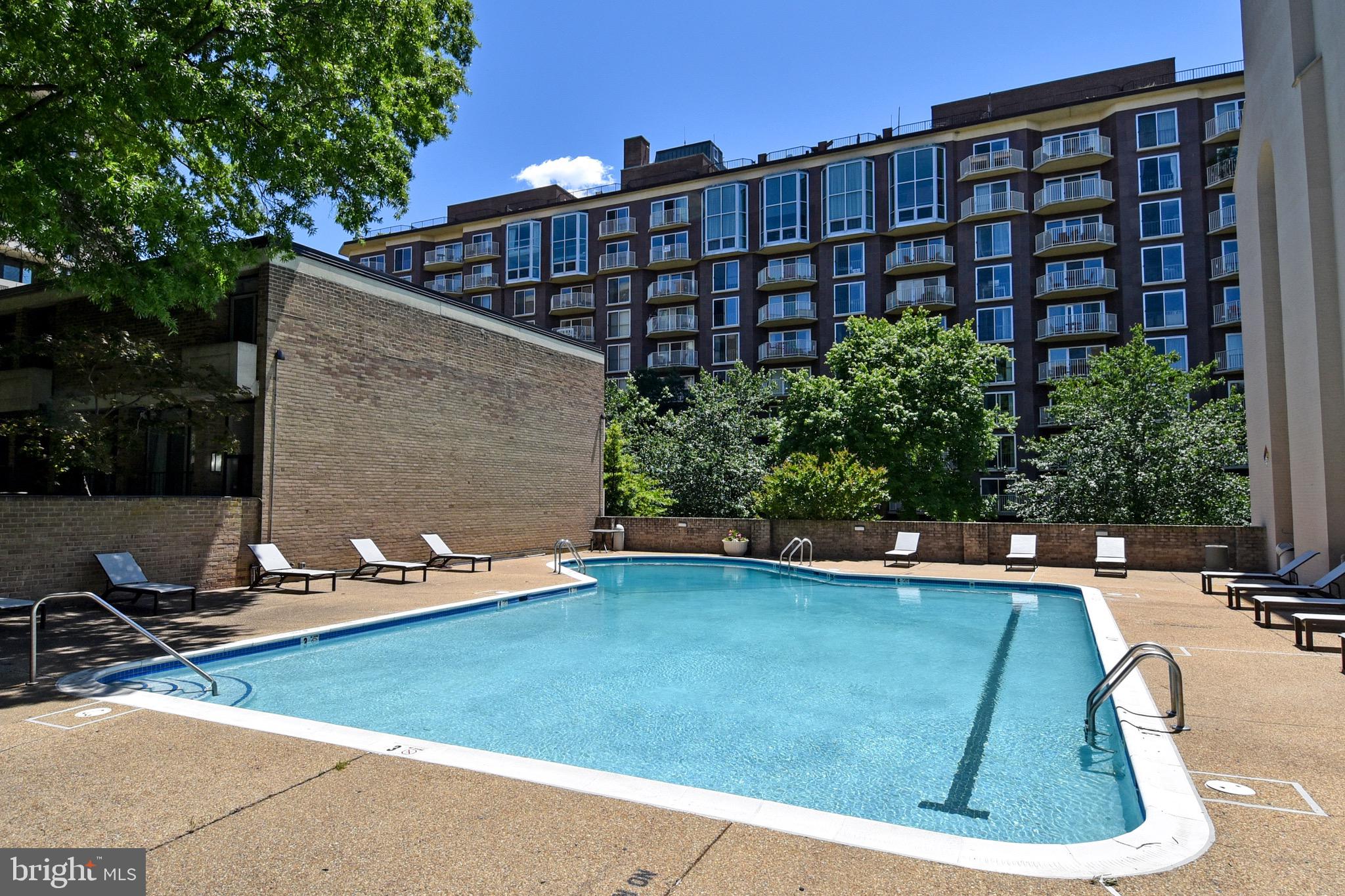 429 N Street Southwest, Unit S607 Washington, DC 20024 - Photo 34 of 55 a view of a swimming pool with a lounge chairs