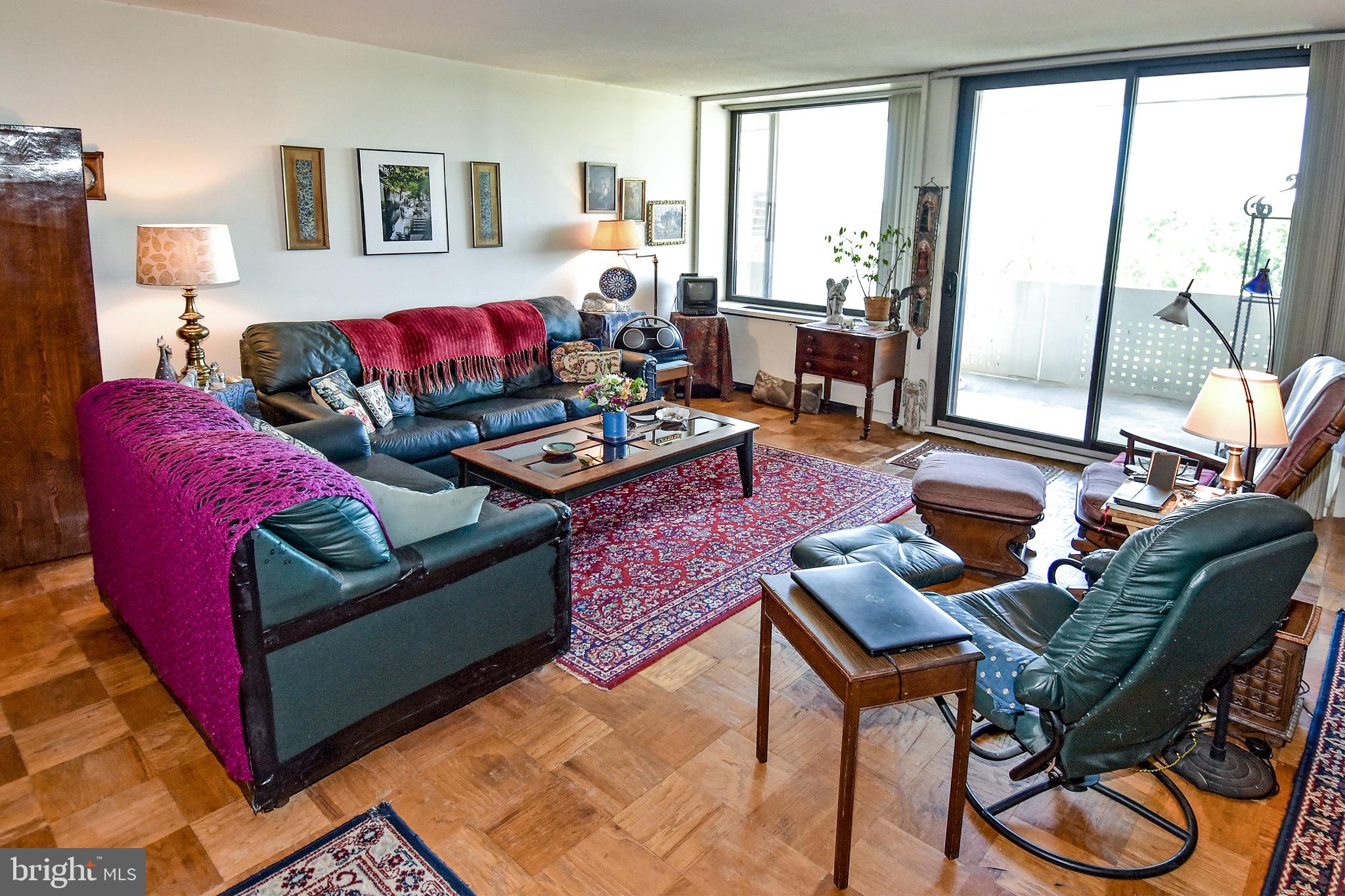 429 N Street Southwest, Unit S607 Washington, DC 20024 - Photo 5 of 55 a living room with furniture and a large window