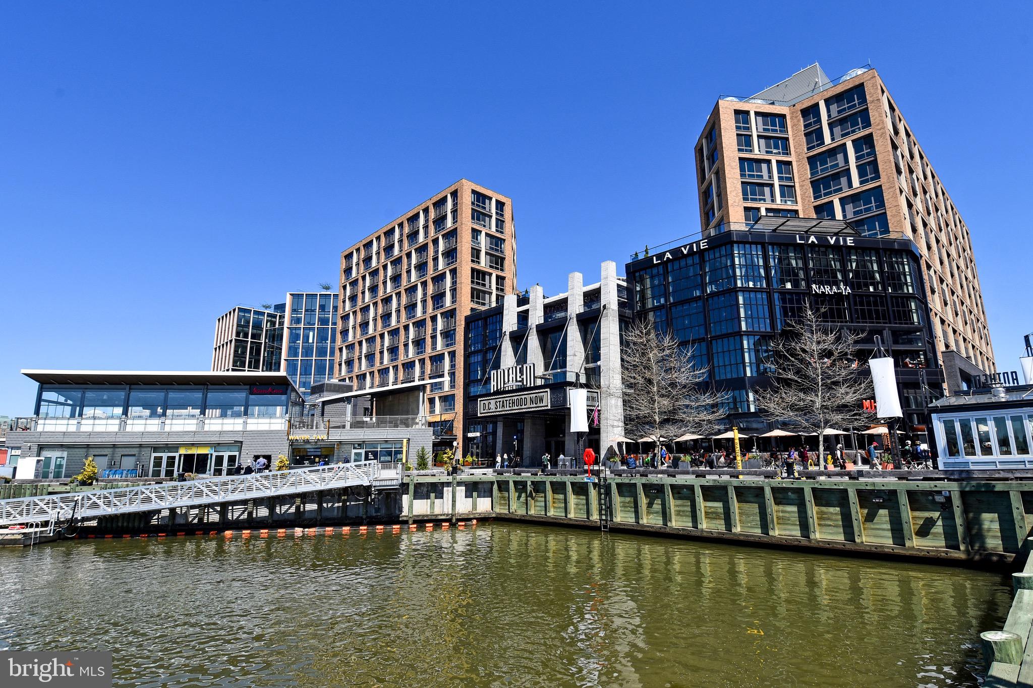 429 N Street Southwest, Unit S607 Washington, DC 20024 - Photo 44 of 55 a view of a large building with a lake view