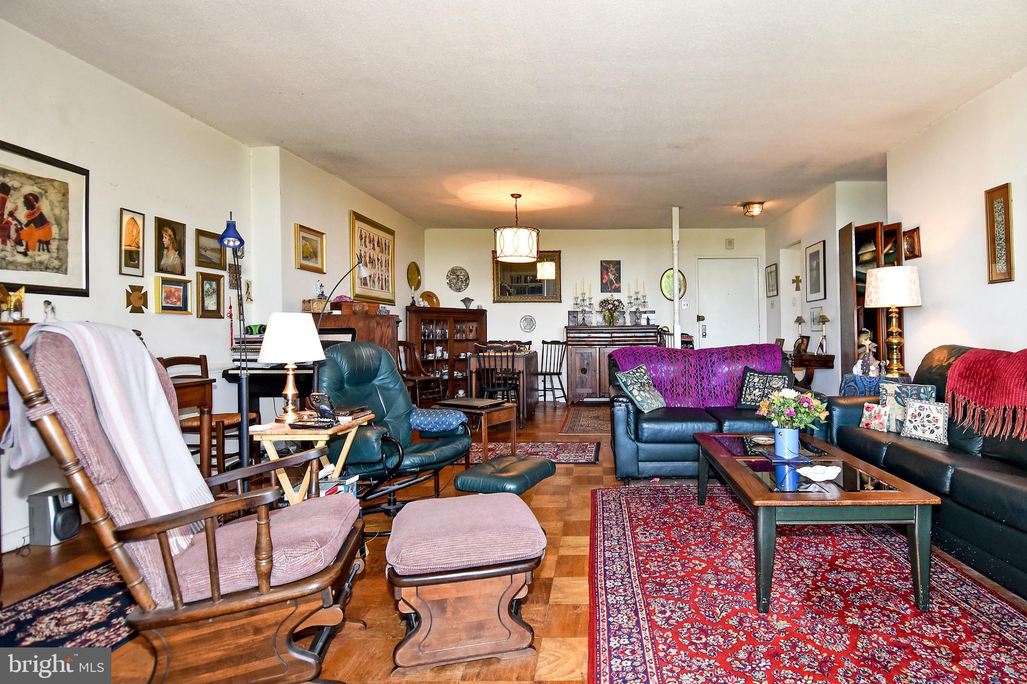 429 N Street Southwest, Unit S607 Washington, DC 20024 - Photo 6 of 55 a living room with lots of furniture and gym equipment