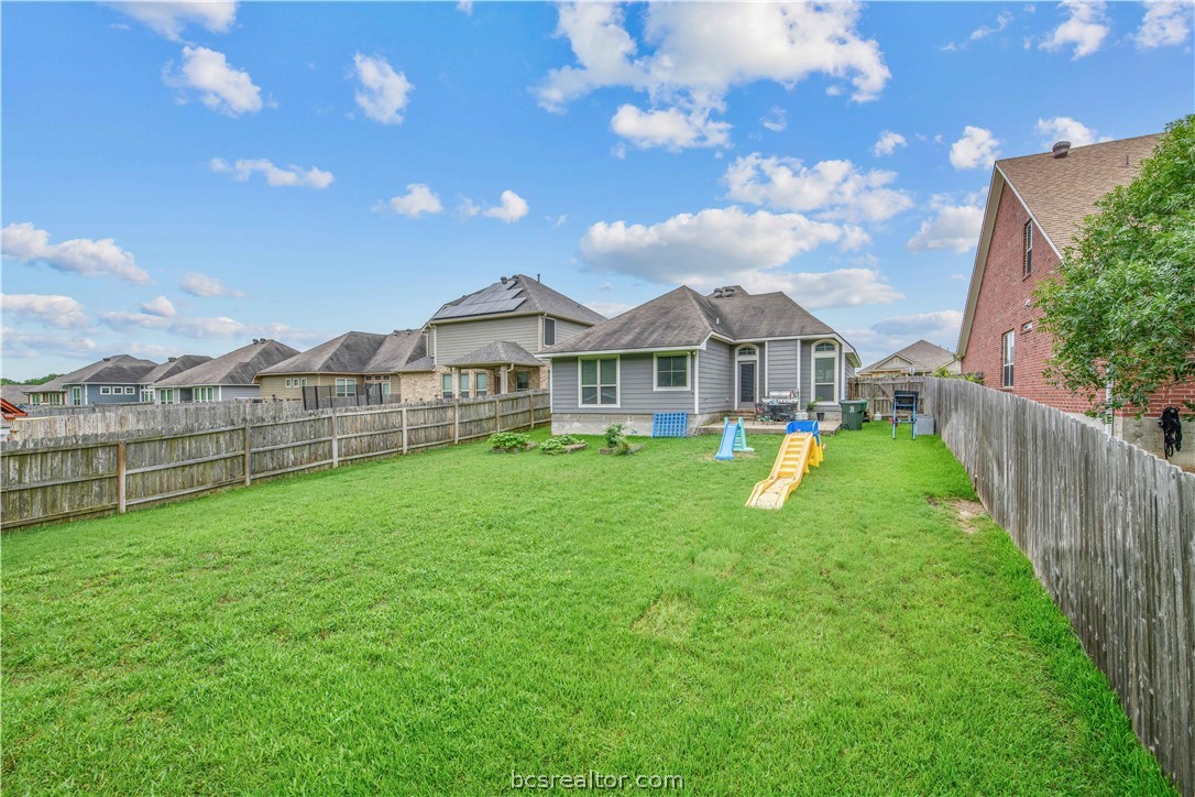 3014 Positano Loop Bryan, TX 77808 - Photo 21 of 23 a view of a house with a yard