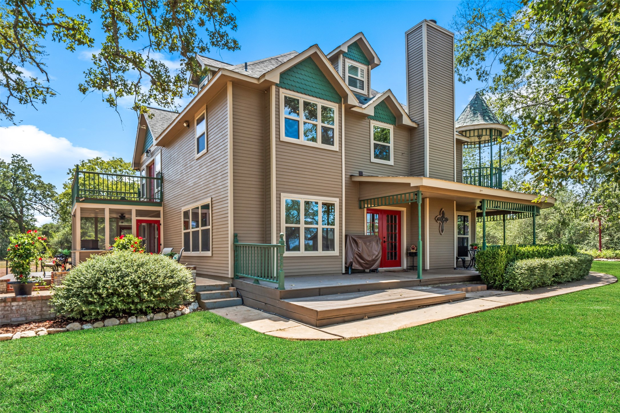 25948 Nelson Road Hempstead, TX 77445 - Photo 35 of 46 Beautiful two-story home surrounded by mature trees with a spacious covered porch overlooking the manicured lawn.