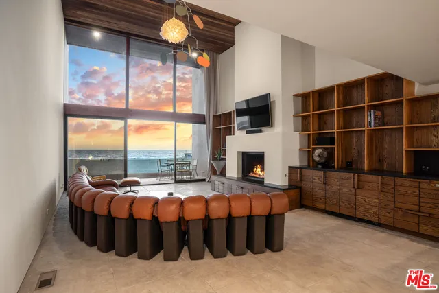 a bedroom with furniture and a fireplace