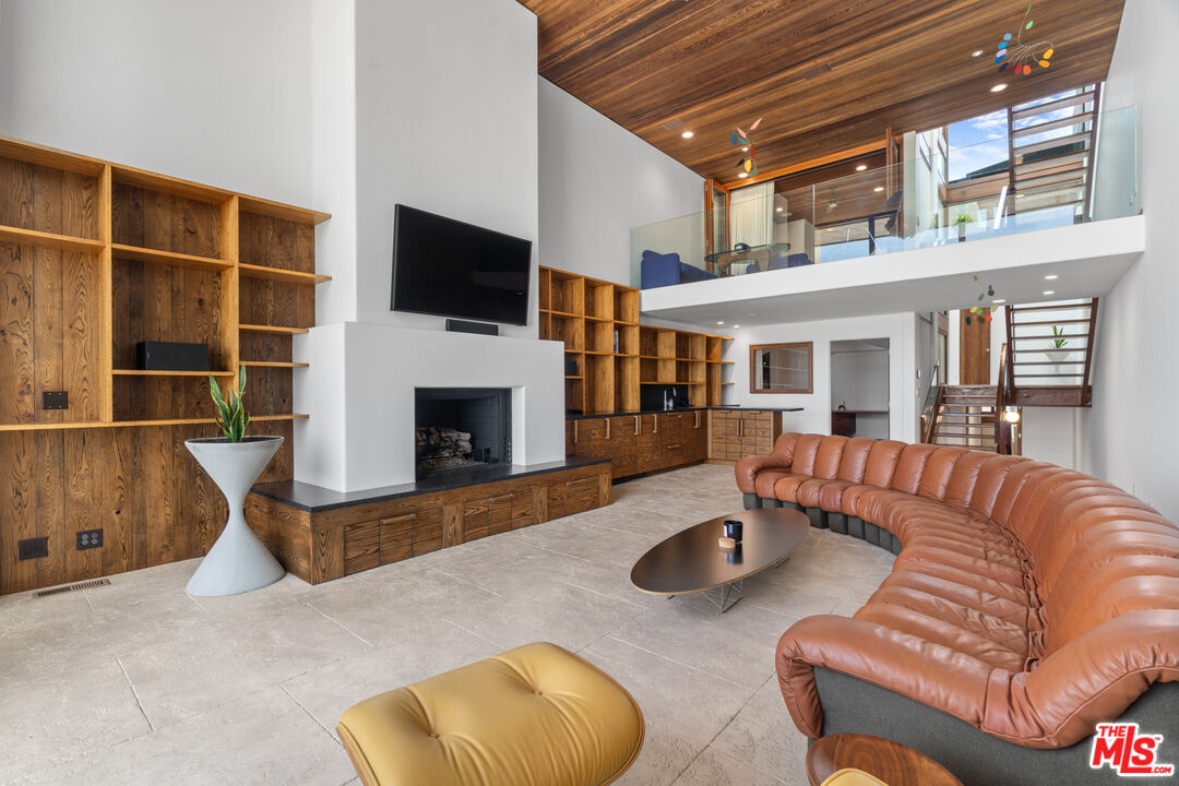 3817 Ocean Front Walk Marina del Rey, CA 90292 - Photo 14 of 25 a living room with furniture a flat screen tv and a fireplace