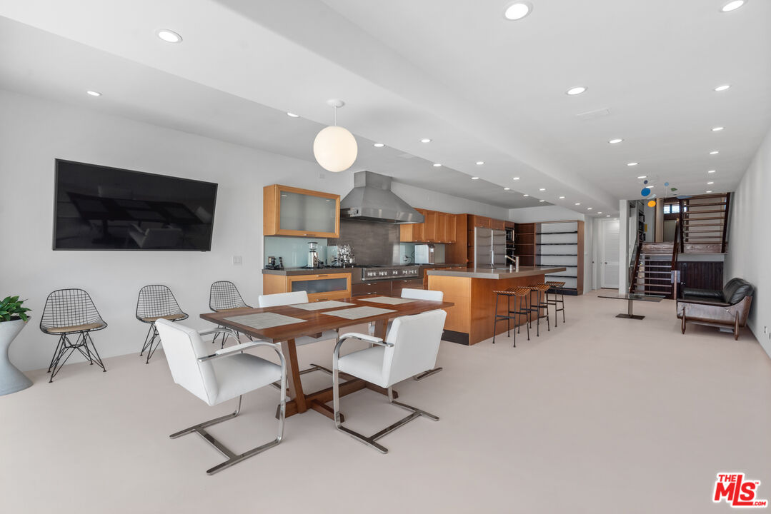 3817 Ocean Front Walk Marina del Rey, CA 90292 - Photo 9 of 25 a living room with furniture and a flat screen tv