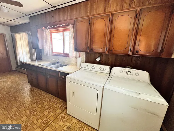 a utility room with dryer and washer