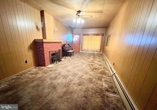 a spacious bedroom with a bed and a chandelier